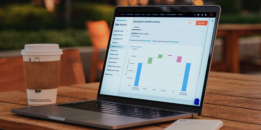 Laptop Sitting On Table With HubSpot Waterfall Report