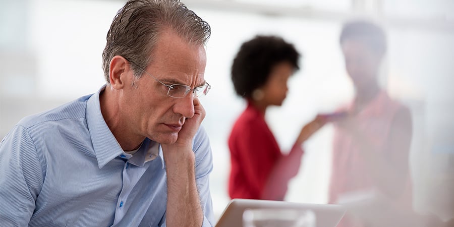 Worried Senior Manager Sitting a Laptop