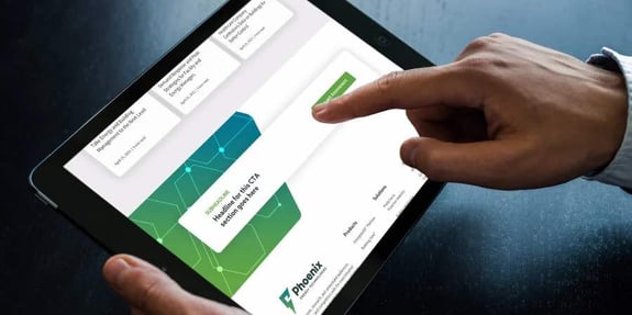 Phoenix Energy Technologies homepage focusing on the call-to-action button being pressed by someone
